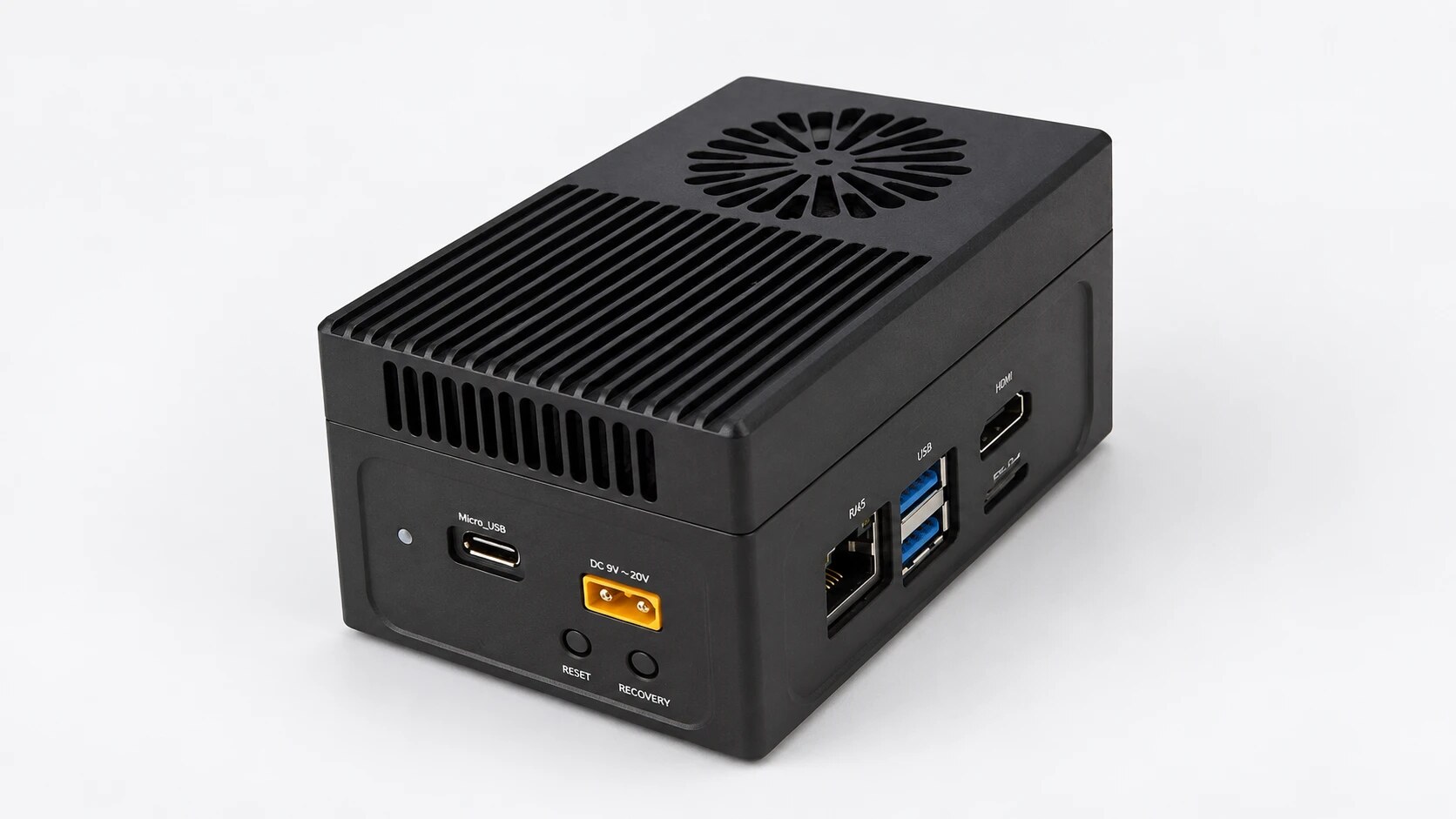 The Kourai Hub: a compact black aluminium box with cooling fins and a round fan grille on top.